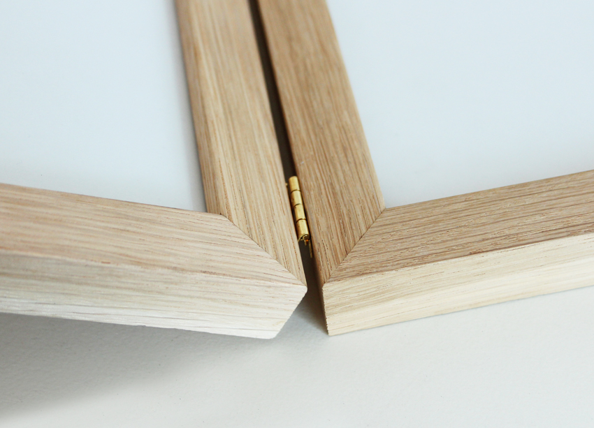 Joint photo frames made with oak wood profile, detail of the joint. Picture frame producer Debex Suisse.